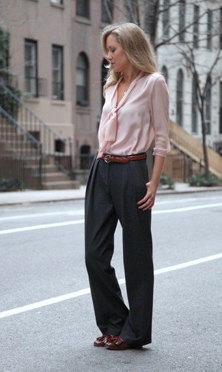 pale pink blouse in front with black wide-leg pants