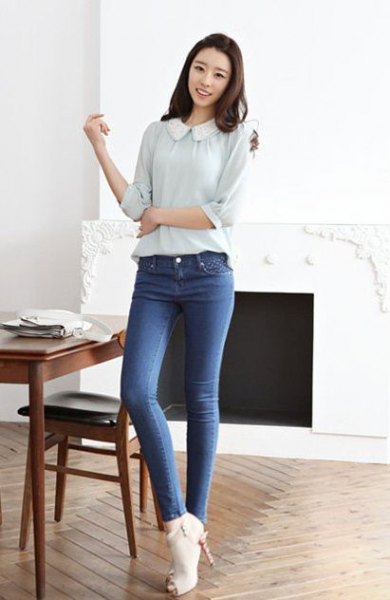 pale pink blouse with round collar and blue jeans