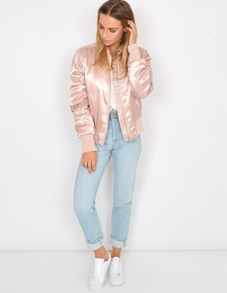 Light pink satin bomber jacket with white shirt and light blue jeans