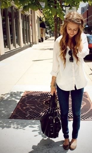 pale yellow long blouse with buttons and slim cut black jeans