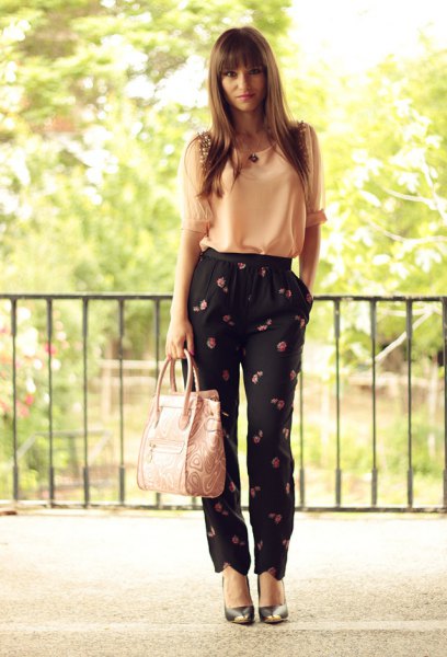 Light yellow chiffon tank top with black pants with a floral pattern