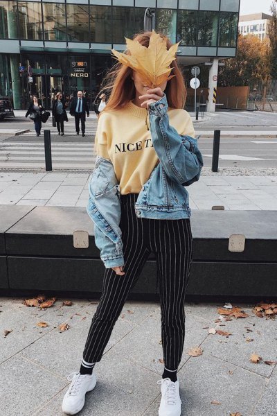 Light yellow printed sweatshirt with black and white striped trousers