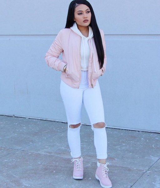 pink bomber jacket white ripped jeans