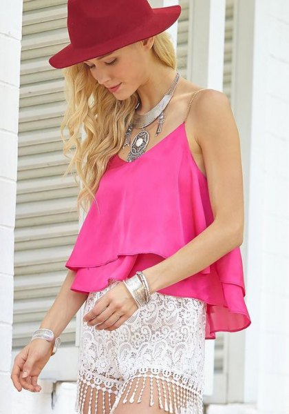 sleeveless top made of pink chiffon with mini-shorts made of white lace