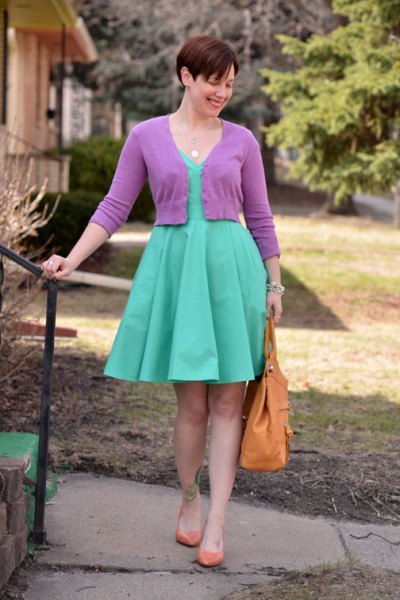 pink short-cut cardigan with a knee-length pleated dress