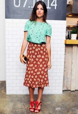 pink blouse with floral pattern and high-waisted red midi skirt