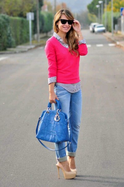 pink knitted sweater with black and white polka dot shirt and cuffed jeans