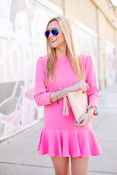 pink long sleeved mini dress with falling waist