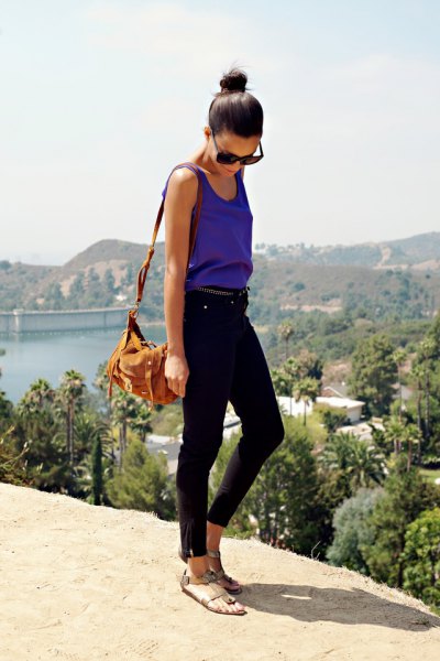 purple waistcoat with round neckline and black ankle jeans