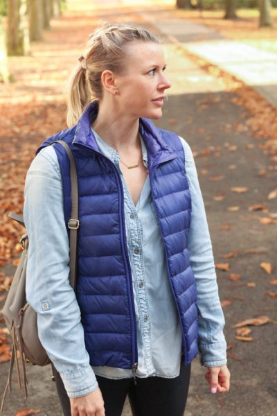 purple down vest with light blue chambray shirt with buttons