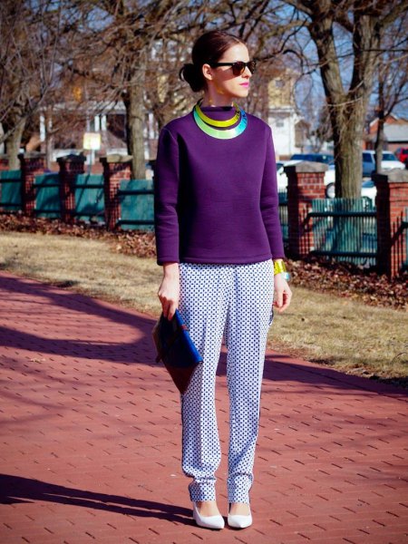 purple long-sleeved top with white and dark printed pants with a relaxed fit