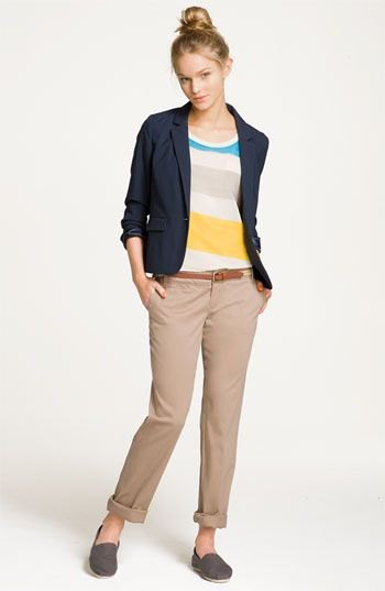Rainbow colored sweater with dark blue travel blazer and cropped pants