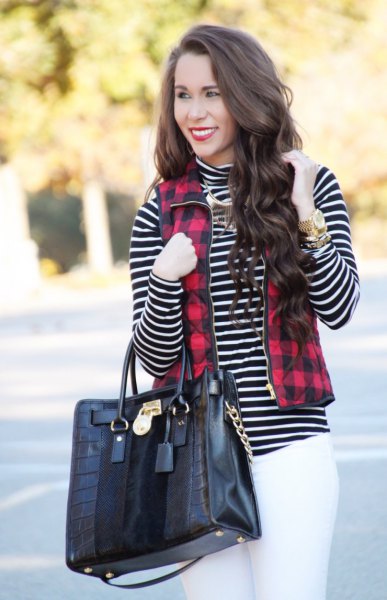 red and black checked vest with full zip, black and white striped mock neck top