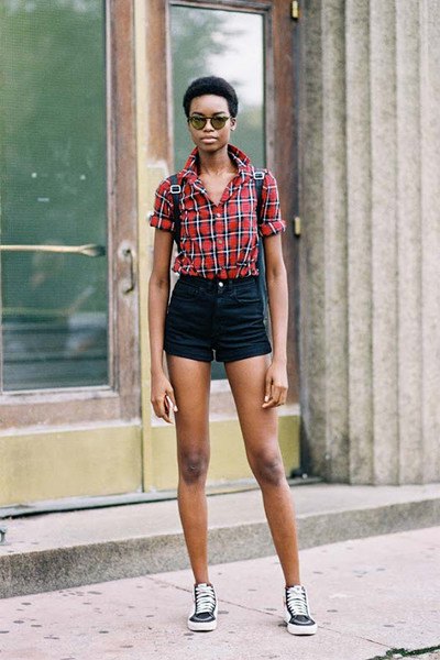 red and blue plaid shirt with buttons and black mini high-rise shorts