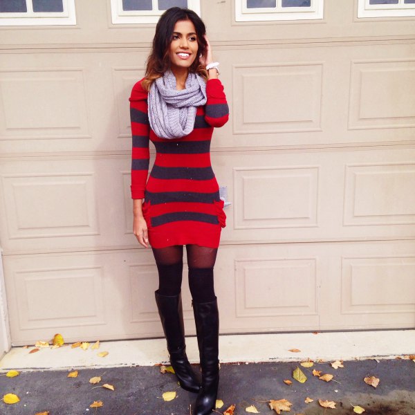 red and dark blue striped, figure-hugging sweater dress with black overknee boots