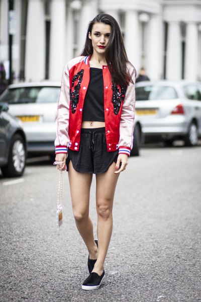 red and pale pink baseball bomber jacket with black mini shorts