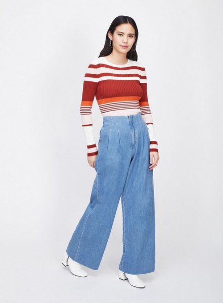 red and white color block sweater with light blue jeans with wide legs