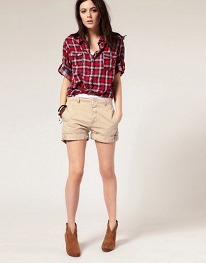 red and white checked boyfriend shirt with beige shorts with cuffs