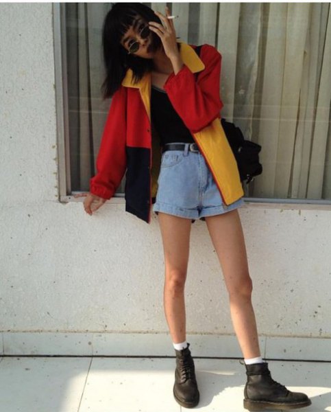 red, black and yellow color-block windbreaker with light blue mini jean shorts