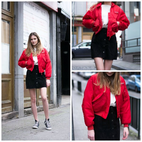 red bomber jacket with black denim mini skirt with button placket