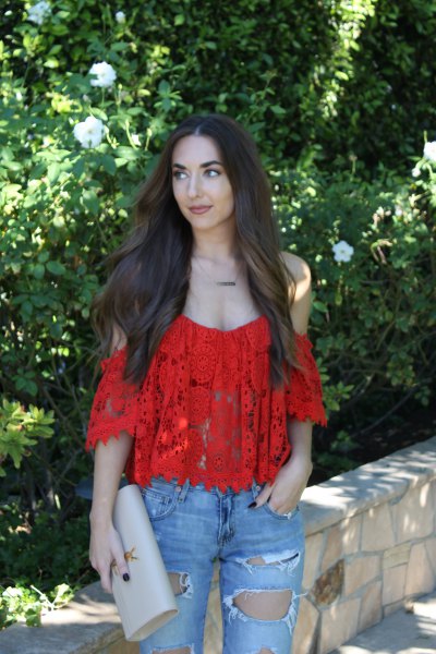 red lace top with cold shoulder and ripped boyfriend jeans