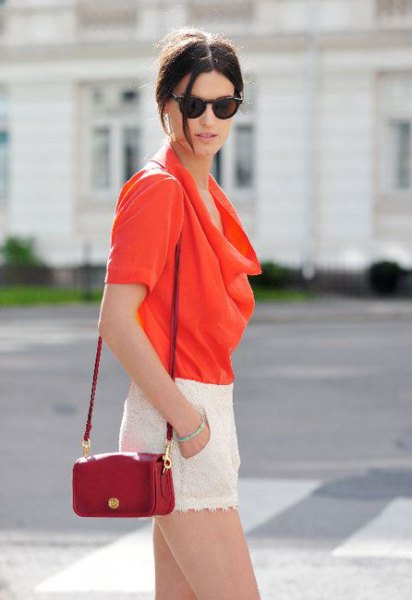 red hooded blouse with brown leather handbag