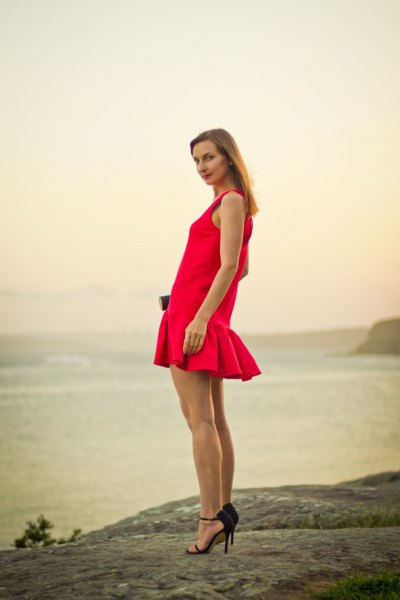 red sleeveless mini dress with fishtail and black heels
