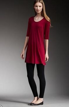 red tunic with half sleeves, black leggings and flats