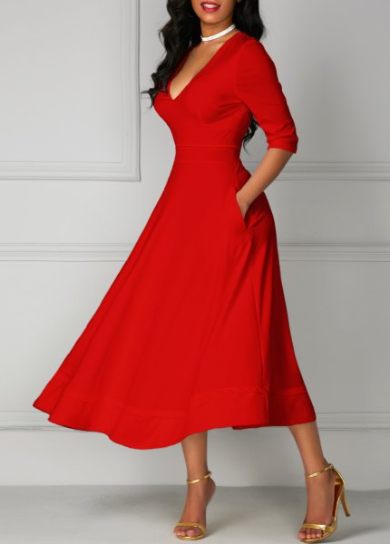 red half sleeves with V-neck and flared midi dress with gold heels
