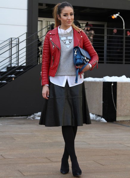 red leather jacket with gray knitted sweater and black skater dress