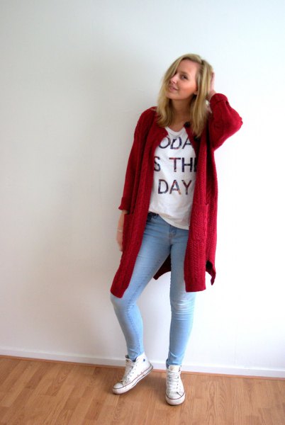 red long cardigan with white printed t-shirt and light blue skinny jeans