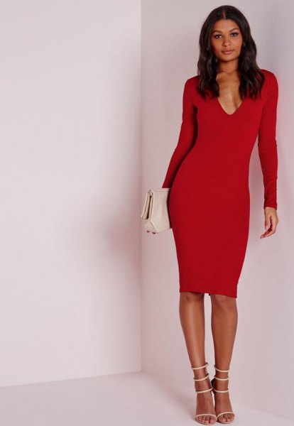 red, long-sleeved midi dress with deep V-neckline and white, open toe heels