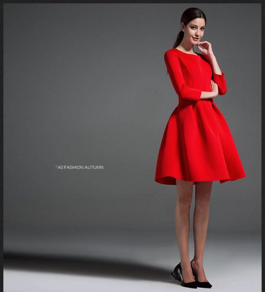 red long-sleeved mini dress with black ballerinas