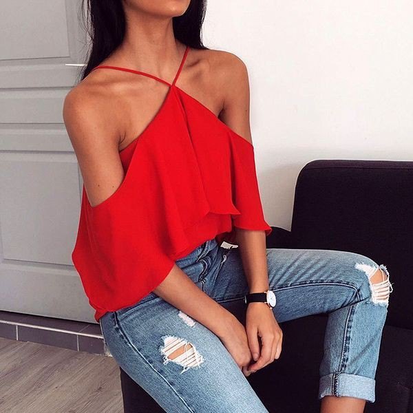 red strapless halterneck top with torn skinny jeans