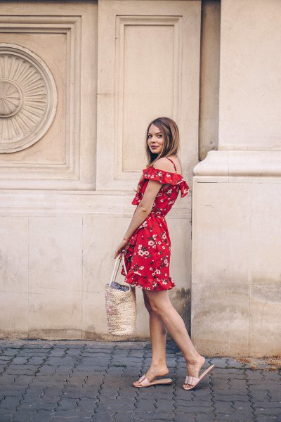 Off the shoulder, red mini dress with a floral pattern and metallic slippers