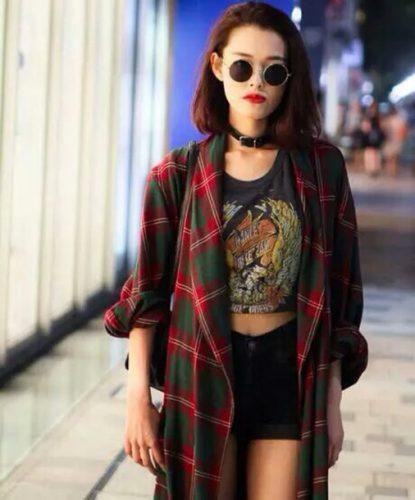 red oversized plaid flannel shirt with cropped black t-shirt and denim shorts