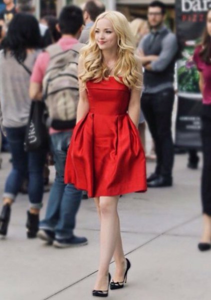 red midi fit and flared dress made of silk with black heels