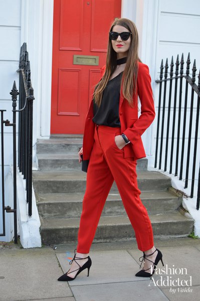 red suit with black scoop neckline and collar