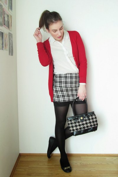 red cardigan with black and white checked mini skirt