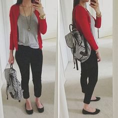 red sweater with a gray t-shirt with a scoop neckline and black, cropped jeans