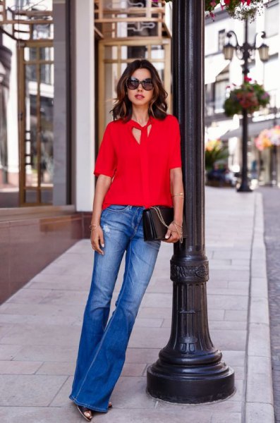red tie blouse blue flared jeans