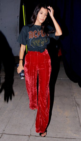 Wide leg trousers in red velvet and black graphic t-shirt