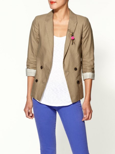 Khaki blazer with rolled sleeves, white tank top with scoop neckline and bright blue jeans