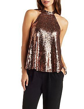 Rose gold sequined halterneck top with black, narrowly cut suit trousers