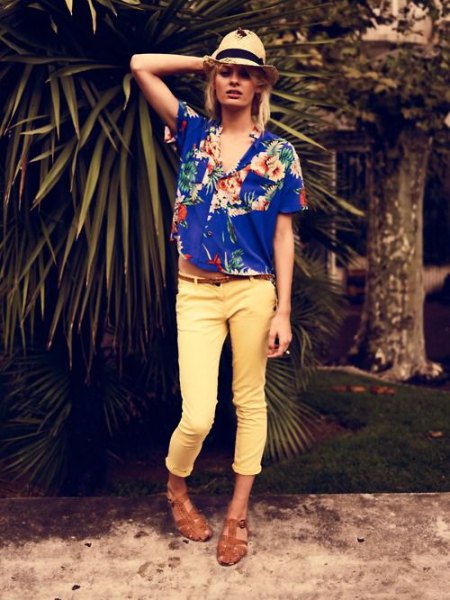 Royal blue aloha shirt with straw hat and yellow trousers