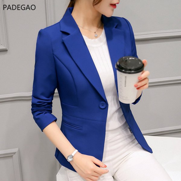 royal blue blazer with white, figure-hugging sweater and matching trousers