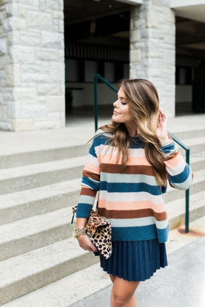 Royal blue, green and pink striped sweater with a pleated mini skirt