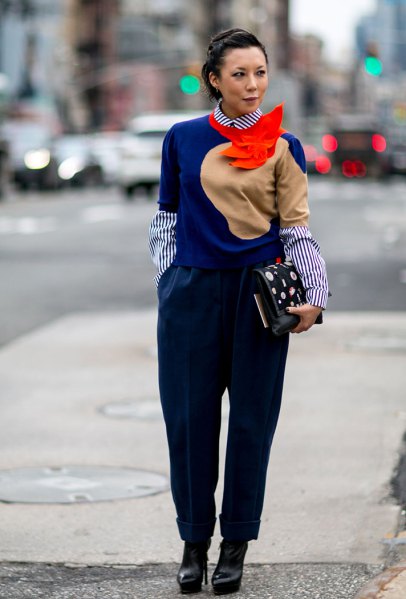 royal blue sweater with striped shirt with round collar and black trousers