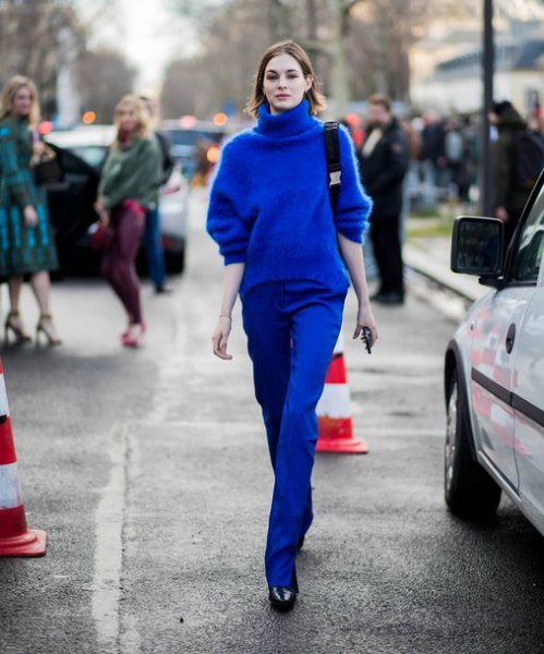 Chunky sweater with a royal blue turtleneck and matching straight leg jeans