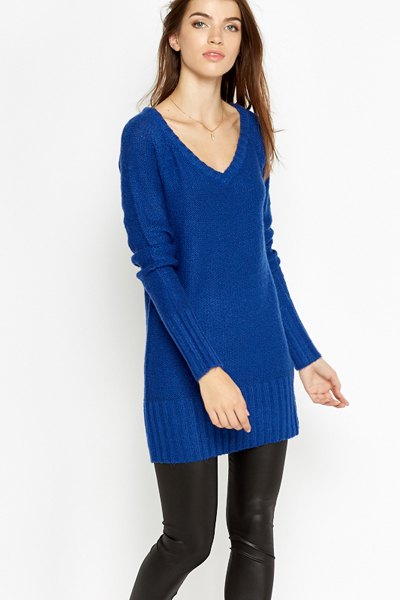 Royal blue tunic sweater with V-neck and black leather gaiters